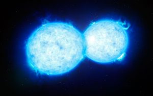 This artist’s impression shows VFTS 352 — the hottest and most massive double star system to date where the two components are in contact and sharing material. The two stars in this extreme system lie about 160 000 light-years from Earth in the Large Magellanic Cloud. This intriguing system could be heading for a dramatic end, either with the formation of a single giant star or as a future binary black hole.